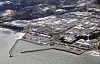 An aerial view of the ruined Fukushima Daiichi nuclear power plant in eastern Japan on Thursday, the first day that the Tokyo Electric Power Company began releasing radioactive water used to cool the melted nuclear reactor into the Pacific Ocean. [YONHAP/KYODO]