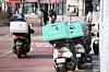 Motorcycles for food delivery services are parked on the road in Mapo District, western Seoul on Feb. 13. [YONHAP]
