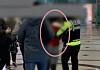 A woman being escorted by police at Jukjeon subway station in Gyeonggi on March 3 after stabbing three subway passengers with a sashimi knife. [YTN CAPTURE]