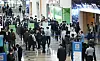 People crowd the entrance to the InterBattery 2020 exhibition held at Coex on Wednesday. This is the first time in two months that Coex is holding an exhibition after the government implemented stricter social distancing in August due to a resurgence of the coronavirus pandemic. [YONHAP]