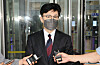 Justice Minister Han Dong-hoon answers questions from reporters as he leaves the government complex in Gwacheon, Gyeonggi on Monday. [YONHAP]