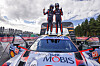 Left, Martin Järveoja, and Ott Tänak, of the Hyundai Shell Mobis World Rally Team, stand on Hyundai Motor's i20N Rally 1 Hybrid racing car. Hyundai Motor won the FIA World Rally Championship (WRC), held from Aug. 4 to 7 in Finland, according to the carmaker on Monday. [YONHAP]