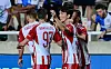 Hwang In-beom with his teammates celebrates after scoring for Olympiacos in an Europa League playoffs game against Apollon Limassol FC at Tsirion Athlitiko Kentro in Cyprus on Thursday. [SCREEN CAPTURE]