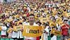 An SK Wyverns cheerleader holds an Emart sign during a collaboration event on July 13, 2019. [SK WYVERNS]