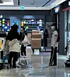 A group of Chinese sellers live stream in front of the MLB store at the Shinsegae Duty Free branch in central Seoul. [LEE TAE-HEE]