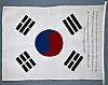 A Taegeukgi signed by freedom fighter Kim Gu (1876-1949) has Kim's handwritten text on the right of the flag describing his desire for Korean independence. [CULTURAL HERITAGE ADMINISTRATION]