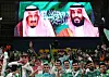 Fans attend a Saudi Pro League match where images of Saudi Crown Prince Mohammed bin Salman and King of Saudi Arabia Salman bin Abdulaziz Al Saud are shown on the big screen in Riyadh in September. [REUTERS/YONHAP]
