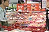 Boxes of peaches selected by an AI system are on display for sales at a Lotte Mart's Seoul Station branch in central Seoul on Thursday. The AI system takes three to four photos of the peaches per second on a conveyor belt to sort out the damaged ones. [YONHAP]