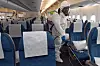Quarantine inspectors sterilize a plane parked at the Incheon International Airport in March 2020. [JOONGANG PHOTO]