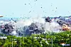 This photo provided by the North Korean government shows the explosion of an inter-Korean liaison office building in Kaesong, North Korea, on June 16, 2020. South Korea says that North Korea has exploded the inter-Korean liaison office building just north of the tense Korean border. [AP/YONHAP]