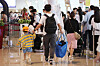 People queue up at Gimpo Airport on Friday, a day before the long-weekend and the Chuseok holidays. [YONHAP]