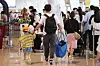 People queue up at Gimpo Airport on Friday, a day before the long-weekend and the Chuseok holidays. [YONHAP]