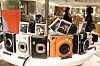 Shoppers browse cameras at a store in Seoul, Monday. Following the lifting of most social distancing measures, many are returning to offices which has led to a rise in demand for business suits. Cameras have also seen an increase in sales as people head outdoors. [YONHAP]