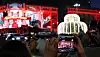 People gather to see Christmas-themed media art on the walls of Shinsaegae Department Store in Myeongdong, in Jung District, central Seoul, on Nov. 22.[YONHAP]
