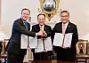Finance Minister Choo Kyung-ho, center, Foreign Minister Park Jin, right, and British Foreign Secretary David Cameron pose for a photo during a signing ceremony of the Strategic Development Partnership in London. [NEWS1]