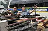 Police examine illegal weapons in front of the Suwon Nambu Police Station in Gwonseon District in Suwon, Gyeonggi, on Monday. The National Police Agency has designated Monday to Sept. 30 as a period for voluntarily reporting illegal weapons in collaboration with the Ministry of National Defense and the Ministry of the Interior and Safety. Under current laws, anyone caught possessing an undeclared weapon can be imprisoned for three to 15 years or fined 30 million won (over $22,000) to 100 million won. [NEWS1]