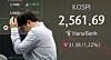 A screen in Hana Bank's trading room in central Seoul shows the Kospi closing at 2,561.69 on Wednesday. [NEWS1]