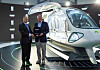 Hyundai Motor Group Chairman Euisun Chung, right, and Rolls-Royce CEO Warren East, standing next to an electric aircraft concept model made by Supernal that is expected to be introduced in 2028, pose for a photo after signing a memorandum of understanding to cooperate on the development of air mobility. [HYUNDAI MOTOR]