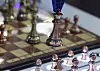 A robot plays chess at the booth of a company participating in Semicon Korea 2025 at Coex in Gangnam District, southern Seoul, on Feb. 19. [YONHAP]