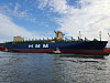 HMM ship is guided into port in Ulsan on March 22. [YONHAP]