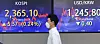 A screen in Hana Bank's trading room in central Seoul shows stock and foreign exchange markets close on Thursday. [YONHAP]