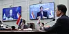 Korean President Moon Jae-in, right, and Dutch Prime Minister Mark Rutte, on right screen, hold a virtual summit in the Blue House on Wednesday. The two leaders agreed to strengthen cooperation on the semiconductor supply chain, 'recognizing each other as core partners in the field of semiconductors,' according to their joint press statement. [YONHAP]