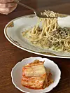 Kimchi is served with pasta at Salt. [HONG SHIN-AE]