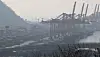 Cargos are stacked on a foggy port in Busan on Sunday. Korea’s 2022 trade deficit came in at a record high $47.2 billion, according to the Ministry of Trade, Industry and Energy. [SONG BONG-GEUN]