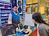 A model at a GS25 demonstrates a face-scanning payment system created by mobile financial firm Toss on Feb. 12. [GS25]
