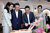 President Yoon Suk Yeol, center left, and first lady Kim Keon-hee, left, view a photo album gifted by Vietnamese President Vo Van Thuong, center right, and first lady Phan Thi Thanh Tam, right, after their breakfast meeting at a restaurant near Hoan Kiem Lake in Hanoi Saturday, the last day of the Korean leader’s three-day state visit. [JOINT PRESS CORPS]