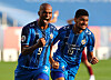 Junior Negao, left, celebrates with Bjorn Johnsen after scoring the winning goal for Ulsan Hyundai FC against Vissel Kobe in the AFC Champions League semifinal in Qatar on Sunday. [REUTERS/YONHAP]