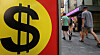 Pedestrians walk past a foreign exchange in Myeong-dong, central Seoul, on Tuesday. The local currency closed at 1,330.9 won against the dollar on Monday to finish above the 1,330 mark for the first time since May 18. The won is losing ground against the dollar over the worse-than-expected producer price index in the United States and the slowing Chinese economy. [NEWS1]