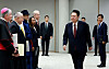 President Yoon Suk Yeol, right, receives the credentials of Archbishop Giovanni Gaspari, the 12th Apostolic Nuncio to South Korea, and 12 newly appointed foreign ambassadors at the Yongsan presidential office in central Seoul on Monday. The envoys were from Paraguay, Bahrain, Mongolia, Papua New Guinea, Sweden, Latvia, Uzbekistan, Belgium, South Africa, Finland, Argentina and Israel. [YONHAP]