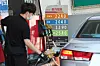 A car owner pumps gas into his car. [NEWS1]