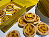 Image of Bang Si-hyuk, HYBE CEO, lies on top of egg tarts sold at HYBE Insight in central Seoul. [JIN MIN-JI]