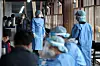 Health workers prepare to receive people who wish to be tested for Covid-19 at a testing center in Songpa District, southern Seoul, on Monday. [NEWS1]