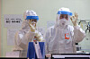 Medical staff in Level D protective suits give the O.K. hand sign in a negative pressure room in Hyemin Hospital, a Covid-19-dedicated hospital in Gwangjin District, eastern Seoul, on Tuesday. [WOO SANG-JO]