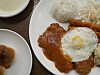 Hangwoon Tonkatsu's saewoo jeongsik is served with tonkatsu, rice, salad, fish cutlet and saewoo twigim, topped with their homemade sauce and fried egg. [HANGWOON TONKATSU]