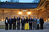 President Yoon Suk Yeol, center left, and first lady Kim Keon-hee, center right, pose for a commemorative photo with a visiting delegation of the Bureau International des Expositions (BIE) overseeing Busan's World Expo 2030 bid at a banquet at the Blue House Sangchunjae in central Seoul Monday. [PRESIDENTIAL OFFICE]