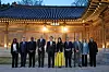 President Yoon Suk Yeol, center left, and first lady Kim Keon-hee, center right, pose for a commemorative photo with a visiting delegation of the Bureau International des Expositions (BIE) overseeing Busan's World Expo 2030 bid at a banquet at the Blue House Sangchunjae in central Seoul Monday. [PRESIDENTIAL OFFICE]