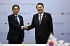 Korean President Yoon Suk Yeol, right, and Japanese Prime Minister Fumio Kishida shake hands prior to holding bilateral talks in Phnom Penh, Cambodia on Nov. 13, 2022. [PRESIDENTIAL OFFICE]