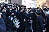 Former President Lee Myung-bak greets former colleagues and supporters in front of his house in Nonhyeon-dong, Seoul, on Friday. It was his first public appearance since being pardoned. [YONHAP]