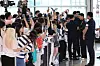 Son Heung-min, far right, signs an autograph at Incheon International Airport in Incheon on Aug. 5. [NEWS1]