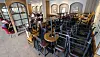 Chairs and tables are stacked up at a coffee shop in central Seoul on Friday afternoon amid social distancing measures. Starting Saturday midnight, all coffee shop chains in the Seoul metropolitan area will only offer take-out services till Sept. 6 midnight. [YONHAP]