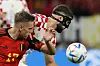 Belgium's Leandro Trossard, left, and Croatia's Josko Gvardiol fight for the ball during the World Cup group F football match between Croatia and Belgium at the Ahmad Bin Ali Stadium in Al Rayyan, Qatar on Thursday. [AP/YONHAP]
