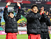 Son Heung-min, right, and Lee Kang-in wave to fans after Korea's 6-0 win against Vietnam in a friendly at Suwon World Cup Stadium in Suwon, Gyeonggi on Oct. 17. [NEWS1]