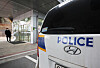 A police car is parked outside Ajou University Hospital in Suwon, Gyeonggi, where Hwacheon Daeyu owner Kim Man-bae is receiving treatment after stabbing himself on Wednesday. [YONHAP]