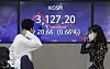 A screen in Hana Bank's trading room in central Seoul shows the Kospi closing at 3,127.20 points on Monday, down 20.66 points, or 0.66 percent from the previous trading day. [YONHAP]