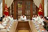 North Korean leader Kim Jong-un, center, convenes a Politburo meeting of the North's ruling Workers' Party Central Committee to discuss preparations for Typhoon Bavi, which is expected to make landfall in the country late Wednesday evening. [YONHAP]
