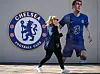 A pedestrian walks past Chelsea's stadium Stamford Bridge in London on March 18. [AFP/YONHAP]